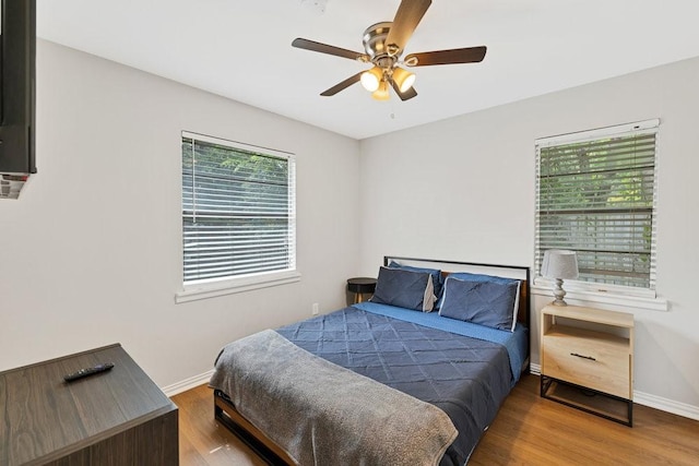 2409 Janice Ln, Fort Worth, TX 76112 - bedroom featuring wood finished floors, baseboards, and ceiling fan