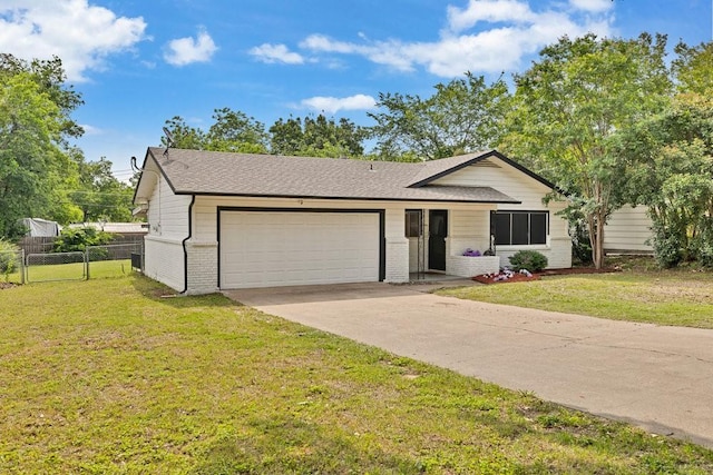 2409 Janice Ln, Fort Worth, TX 76112 - ranch-style home with brick siding, a garage, concrete driveway, and a shingled roof