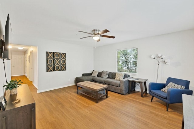 2409 Janice Ln, Fort Worth, TX 76112 - living room with light wood-type flooring, ceiling fan, and baseboards