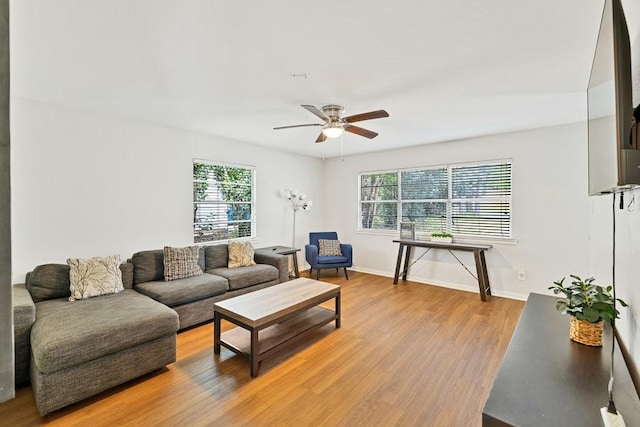 2409 Janice Ln, Fort Worth, TX 76112 - living room featuring ceiling fan, light wood-type flooring, and baseboards