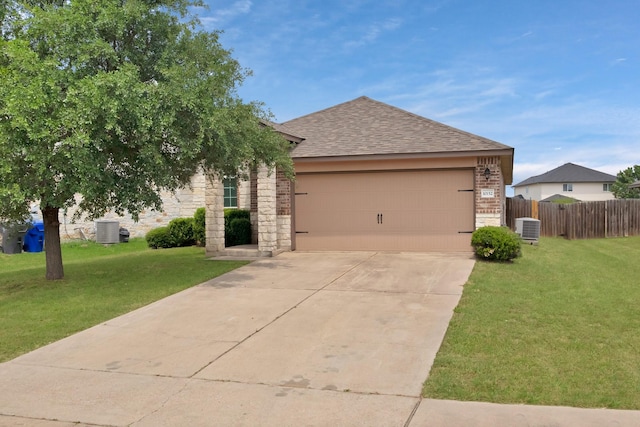 10152 Parker Springs Dr, Waco, TX 76708 - view of front of home with central AC unit, a shingled roof, a garage, and stone siding