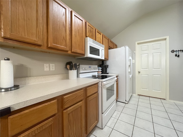 813 Green Acres Ln, Midlothian, TX 76065 - kitchen with white appliances, vaulted ceiling, light countertops, light tile patterned floors, and brown cabinetry