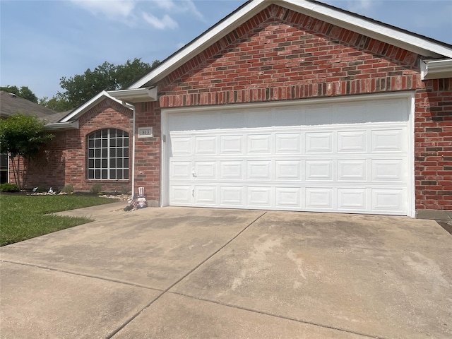 813 Green Acres Ln, Midlothian, TX 76065 - view of front of home featuring brick siding, an attached garage, and concrete driveway