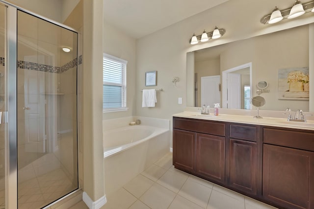 2202 Louis Trl, Weatherford, TX 76087 - full bathroom featuring a garden tub, a shower stall, tile patterned floors, and double vanity