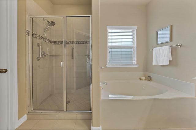 2202 Louis Trl, Weatherford, TX 76087 - bathroom featuring a shower stall, a garden tub, and tile patterned flooring