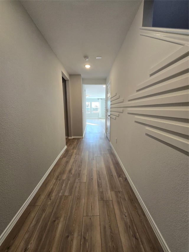 254 Lake Erie Dr, Princeton, TX 75407 - hall with dark wood-type flooring, baseboards, and a textured wall