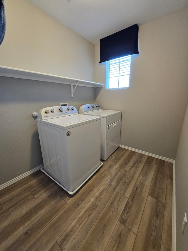 254 Lake Erie Dr, Princeton, TX 75407 - laundry room featuring wood finished floors, washer and dryer, and baseboards