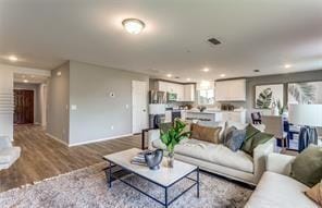 254 Lake Erie Dr, Princeton, TX 75407 - living room featuring wood finished floors, baseboards, and recessed lighting