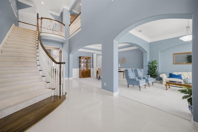 2410 Gail St, Royse City, TX 75189 - entryway featuring arched walkways, baseboards, stairway, crown molding, and tile patterned floors