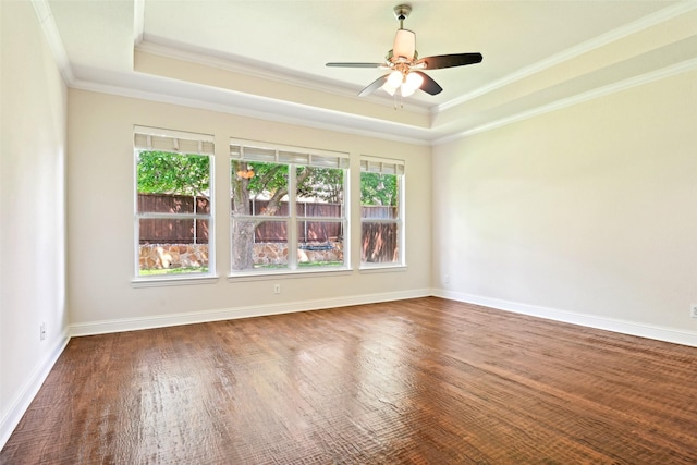 8604 Preston Wood Dr, Mckinney, TX 75072 - empty room with a raised ceiling, ornamental molding, a ceiling fan, wood finished floors, and baseboards