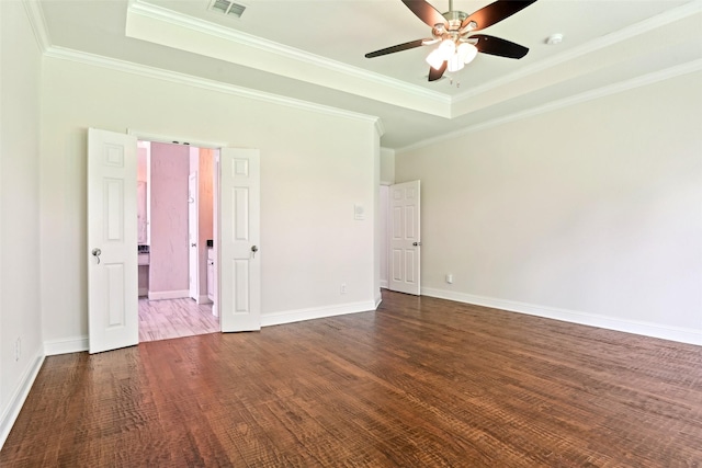 8604 Preston Wood Dr, Mckinney, TX 75072 - empty room featuring a tray ceiling, a ceiling fan, wood finished floors, crown molding, and baseboards