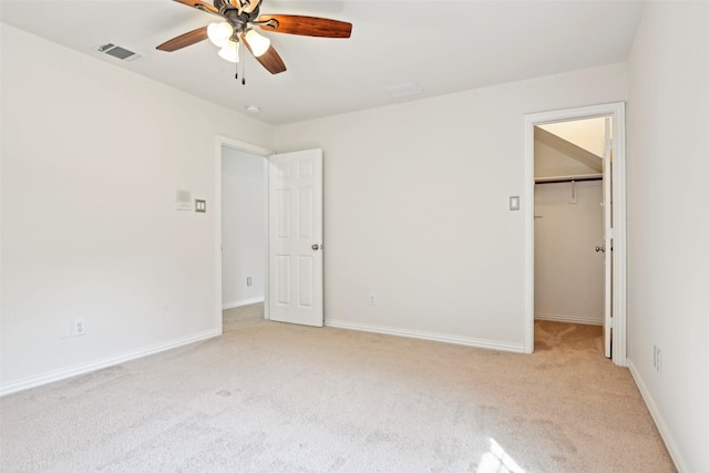 8604 Preston Wood Dr, Mckinney, TX 75072 - unfurnished bedroom with light carpet, a walk in closet, baseboards, and ceiling fan