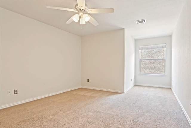 8604 Preston Wood Dr, Mckinney, TX 75072 - spare room featuring light colored carpet, a ceiling fan, and baseboards