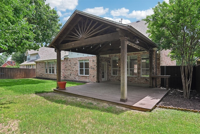 8604 Preston Wood Dr, Mckinney, TX 75072 - rear view of house with a wooden deck, brick siding, and a gazebo