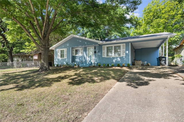 1128 Redbud St, Denison, TX 75020 - view of front of property with driveway and a carport