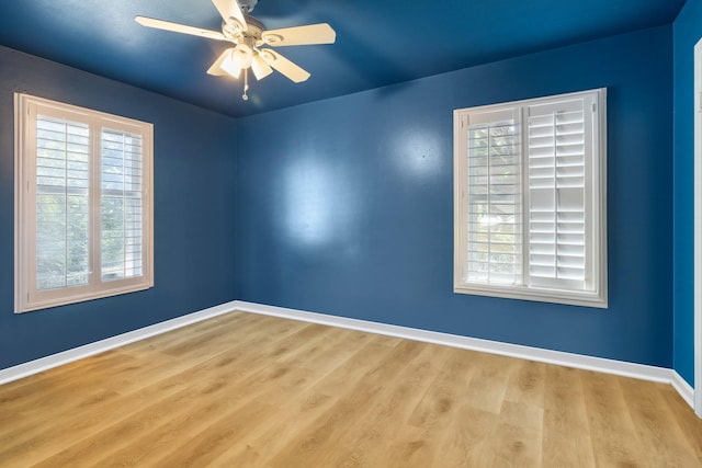 1128 Redbud St, Denison, TX 75020 - spare room with plenty of natural light, wood finished floors, baseboards, and a ceiling fan