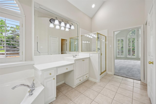 1612 University Dr, Allen, TX 75013 - bathroom with a stall shower, tile patterned floors, vanity, a garden tub, and high vaulted ceiling