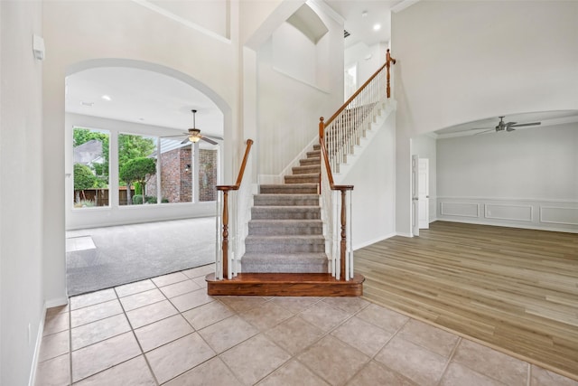 1612 University Dr, Allen, TX 75013 - tiled foyer with a ceiling fan, stairway, a high ceiling, arched walkways, and recessed lighting