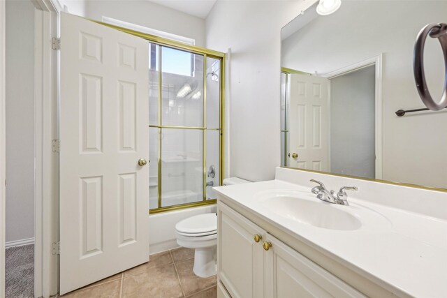 1612 University Dr, Allen, TX 75013 - bathroom featuring toilet, vanity, enclosed tub / shower combo, and tile patterned flooring