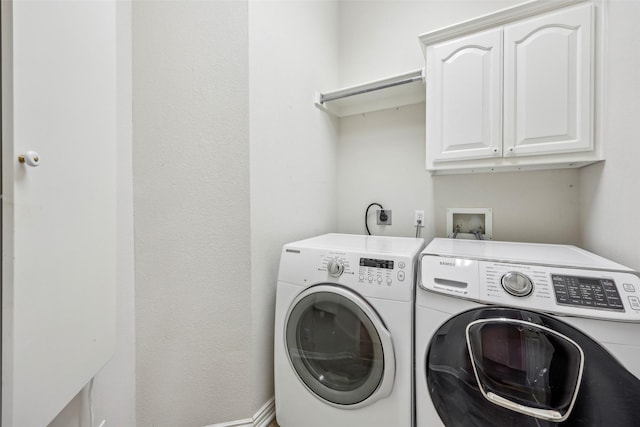 1612 University Dr, Allen, TX 75013 - clothes washing area with cabinet space and washer and dryer