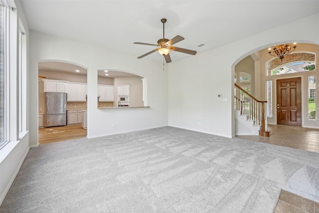 1612 University Dr, Allen, TX 75013 - unfurnished living room with light colored carpet, a chandelier, ceiling fan, baseboards, and recessed lighting