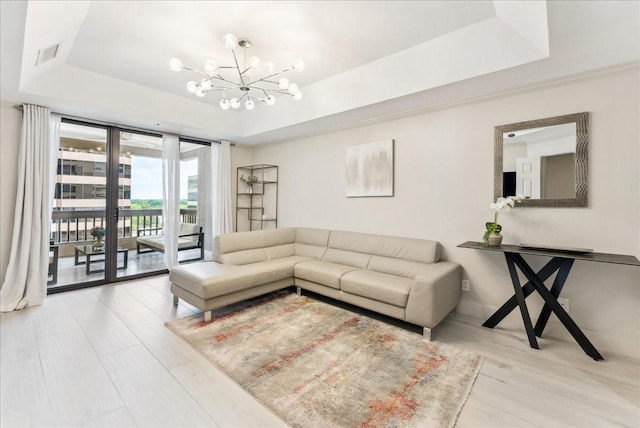 5909 Luther Ln Unit 1002, Dallas, TX 75225 - living area with a tray ceiling, a chandelier, and wood finished floors