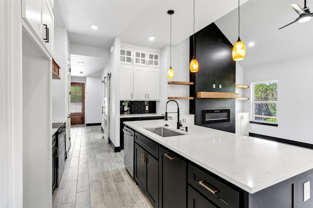 2519 Lakeridge Dr, Granbury, TX 76048 - kitchen with a sink, white cabinets, open shelves, dishwasher, and dark cabinetry
