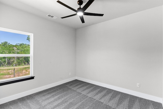 2519 Lakeridge Dr, Granbury, TX 76048 - empty room with dark carpet, ceiling fan, and baseboards