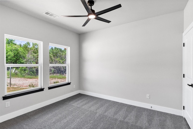2519 Lakeridge Dr, Granbury, TX 76048 - spare room featuring dark colored carpet, a ceiling fan, and baseboards