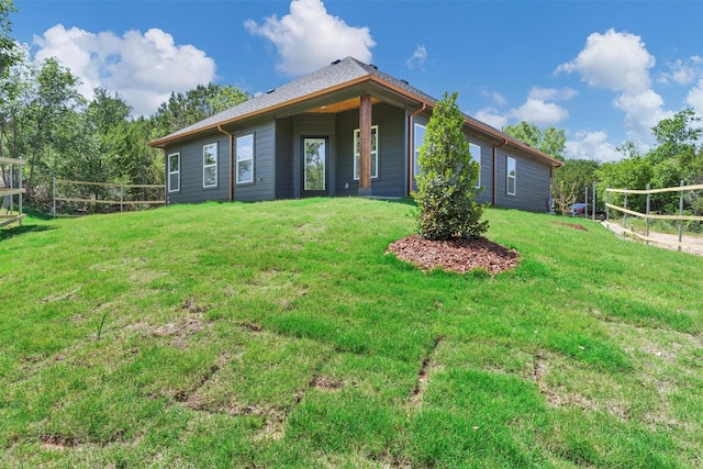 2519 Lakeridge Dr, Granbury, TX 76048 - rear view of house featuring a yard