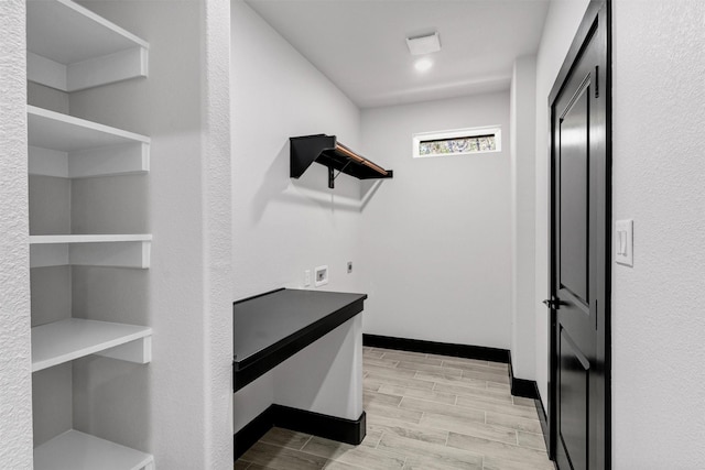 2519 Lakeridge Dr, Granbury, TX 76048 - hallway featuring wood tiled floors and baseboards