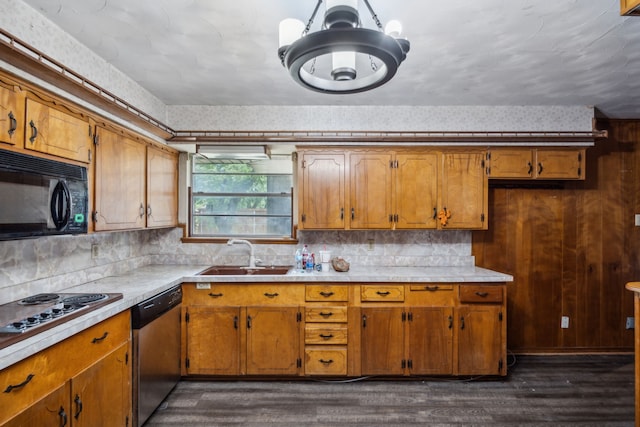 4518 Live Oak Dr, Mesquite, TX 75150 - kitchen with a sink, stainless steel appliances, brown cabinets, and light countertops