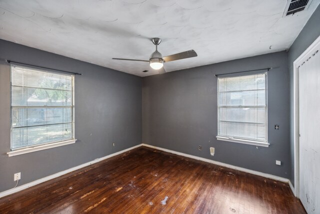 4518 Live Oak Dr, Mesquite, TX 75150 - unfurnished room featuring hardwood / wood-style floors, healthy amount of natural light, baseboards, and ceiling fan