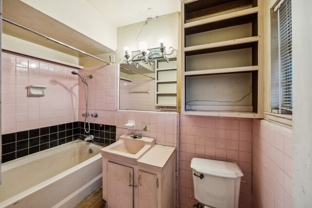 4518 Live Oak Dr, Mesquite, TX 75150 - full bathroom featuring tile walls, bathtub / shower combination, vanity, and toilet