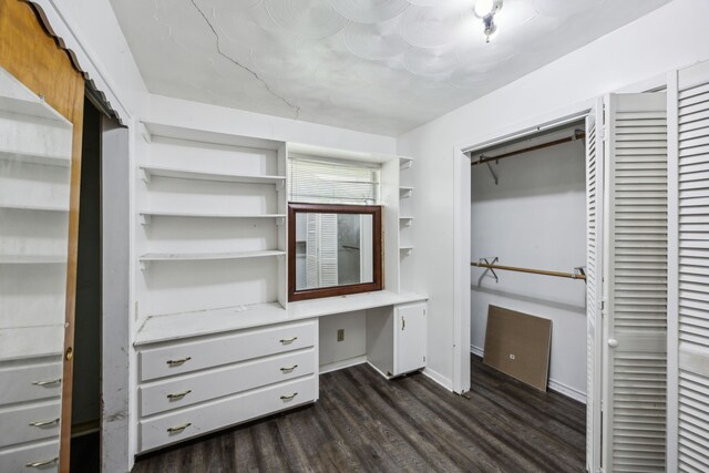 4518 Live Oak Dr, Mesquite, TX 75150 - spacious closet featuring dark wood-style flooring and built in desk