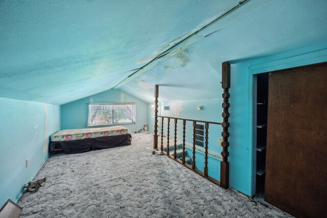 4518 Live Oak Dr, Mesquite, TX 75150 - carpeted bedroom with vaulted ceiling and a textured ceiling