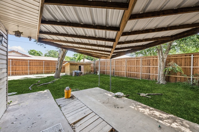 4518 Live Oak Dr, Mesquite, TX 75150 - view of patio / terrace featuring an outdoor structure and a storage shed