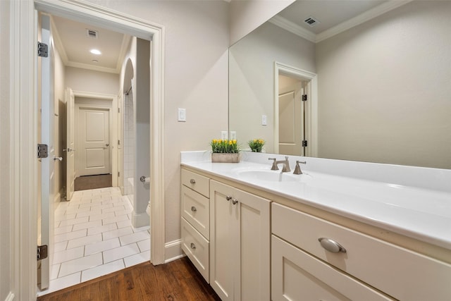 4702 Dexter Ave, Fort Worth, TX 76107 - full bathroom with crown molding, vanity, a shower, wood finished floors, and baseboards