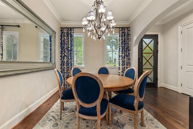 4702 Dexter Ave, Fort Worth, TX 76107 - dining area featuring dark wood-type flooring, arched walkways, baseboards, a chandelier, and crown molding