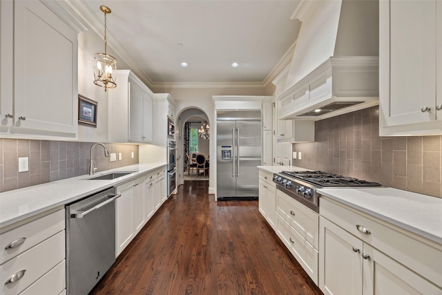 4702 Dexter Ave, Fort Worth, TX 76107 - kitchen with stainless steel appliances, a sink, arched walkways, crown molding, and custom exhaust hood