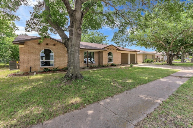 7616 Circle Dr, North Richland Hills, TX 76180 - ranch-style home featuring a garage, driveway, brick siding, and a front yard