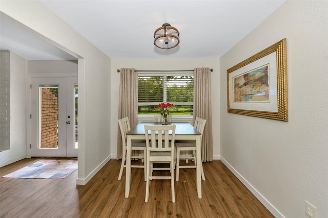 7616 Circle Dr, North Richland Hills, TX 76180 - dining area with french doors, wood finished floors, and baseboards