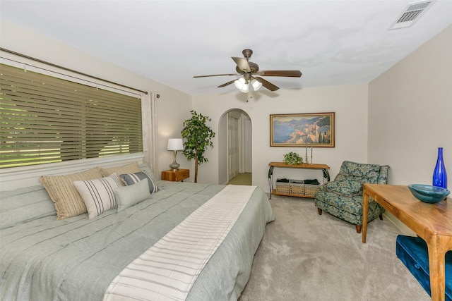 7616 Circle Dr, North Richland Hills, TX 76180 - carpeted bedroom featuring arched walkways and a ceiling fan