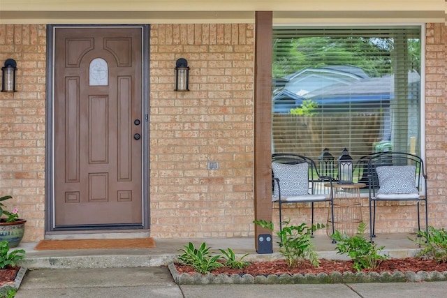 7616 Circle Dr, North Richland Hills, TX 76180 - view of exterior entry with brick siding and covered porch