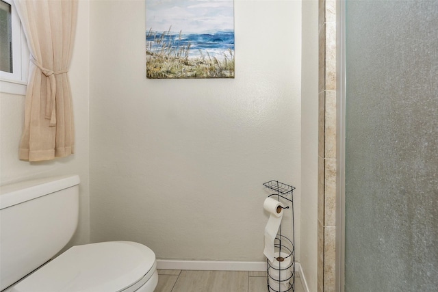 7616 Circle Dr, North Richland Hills, TX 76180 - bathroom featuring toilet and baseboards