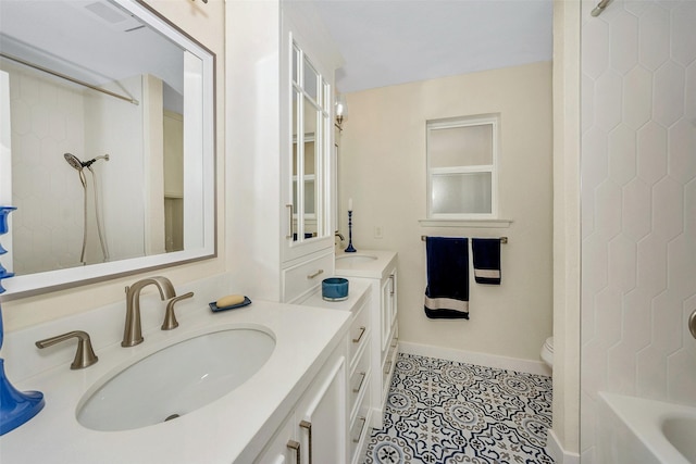 7616 Circle Dr, North Richland Hills, TX 76180 - full bath with vanity, tile patterned floors, baseboards, and toilet