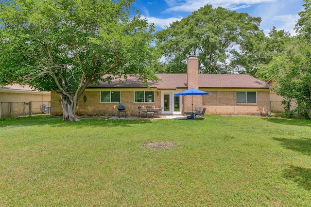 7616 Circle Dr, North Richland Hills, TX 76180 - back of property with a chimney, brick siding, and a patio area