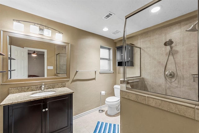 802 Walden Ct, Allen, TX 75002 - full bathroom featuring a tile shower, baseboards, toilet, and vanity