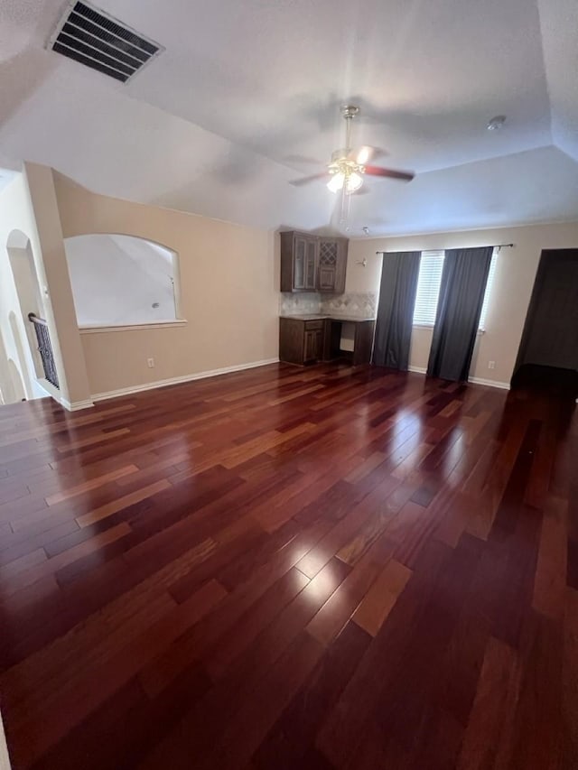 8205 Fountain Springs Dr, Plano, TX 75025 - unfurnished living room featuring ceiling fan, lofted ceiling, baseboards, and dark wood finished floors