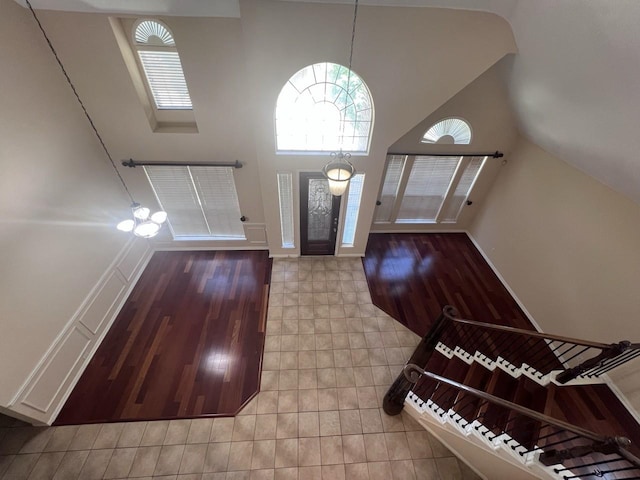 8205 Fountain Springs Dr, Plano, TX 75025 - entrance foyer featuring wood finished floors, baseboards, and lofted ceiling